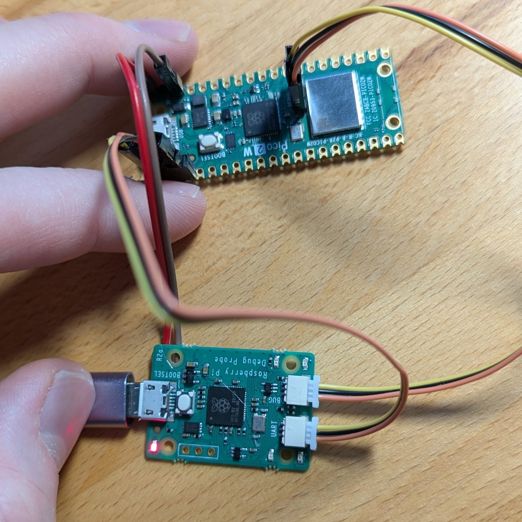 Raspberry Pi Pico2w connected to a Raspberry Pi Debug Probe with a few wires